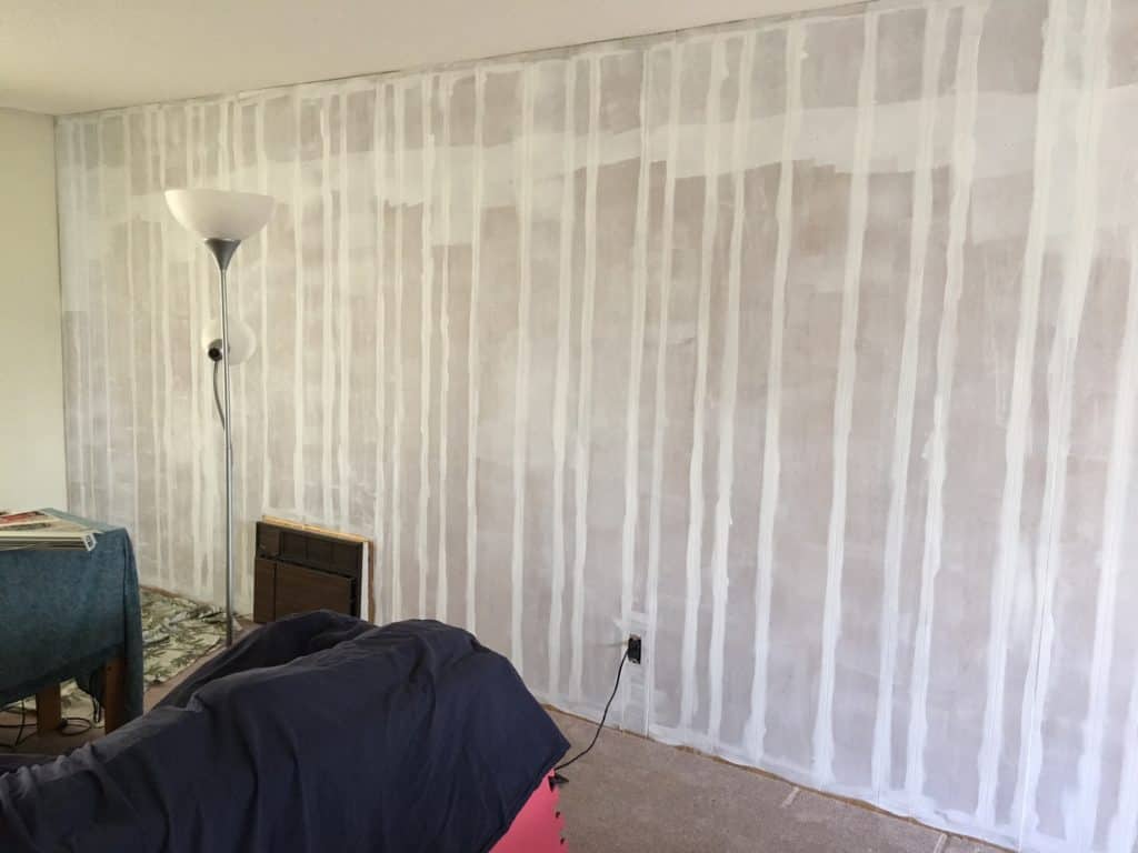 1970's wood paneling primed with a roller
