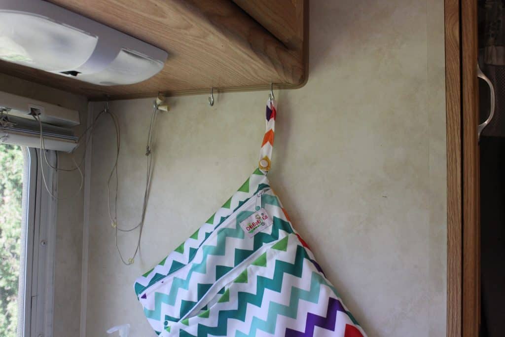 Wooden hooks make a good RV kitchen organization hack
