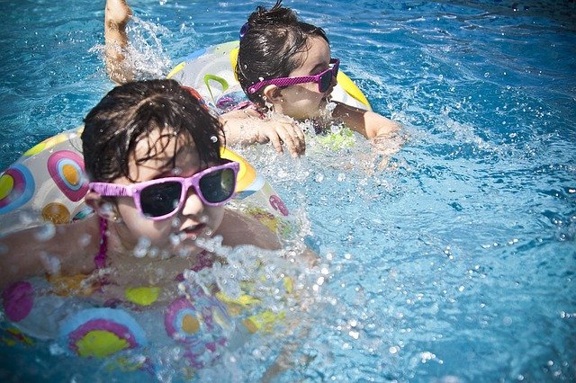 Swimming in an indoor pool is a fun children's winter birthday party ideas.
