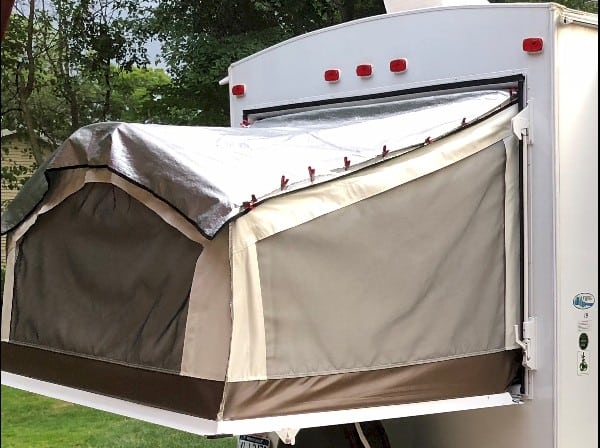 Pop up gizmos camper bunk end cover to reflect heat