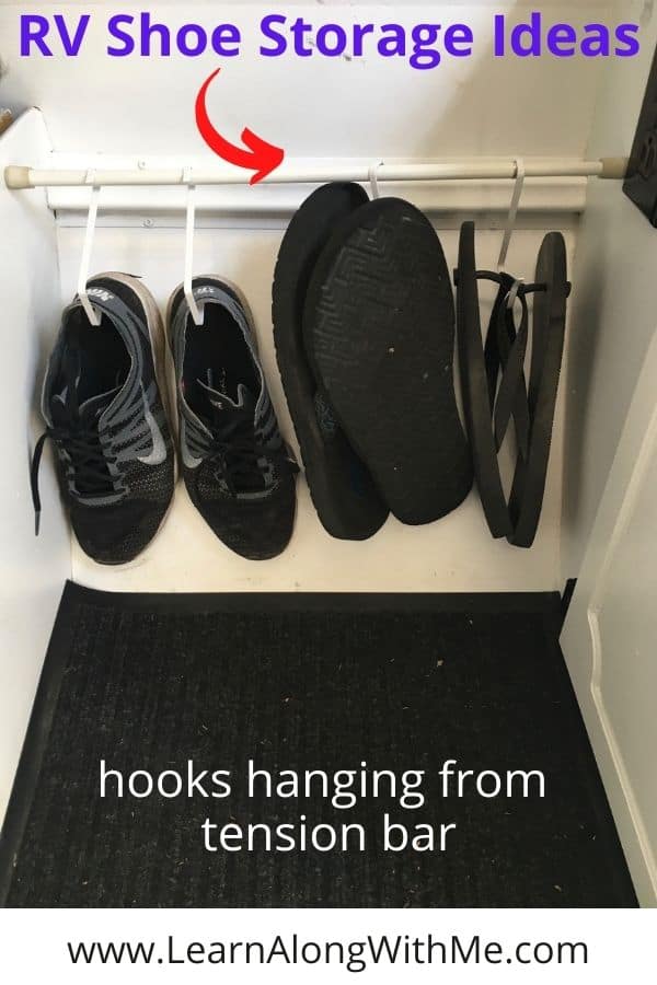RV shoe storage - using hooks hanging from a tension bar spread between two cabinets in a pop up camper