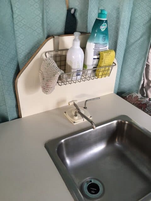 Hanging Wire basket above our pop up camper sink.