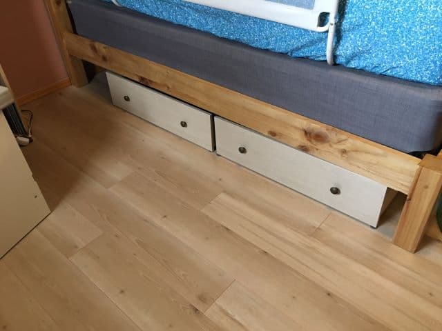 Repurposing old dresser drawers to be used as under bed storage drawers.