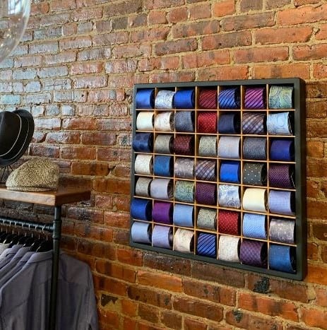 Here is a well crafted tie display rack that allow you to place your rolled-up ties inside one of the 49 tie storage cubes