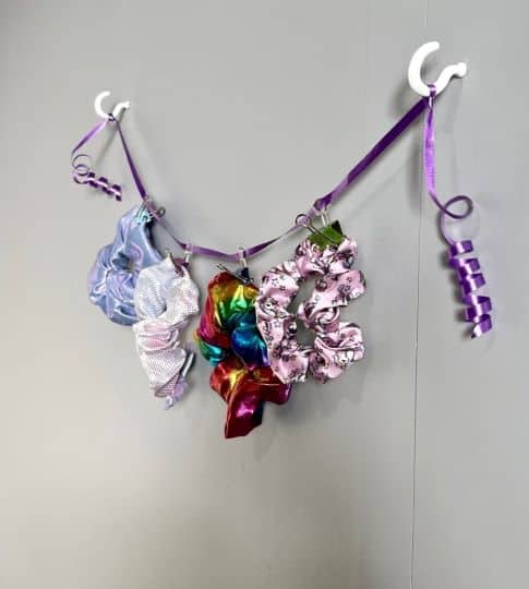 Binder clips can work well to hold scrunchies