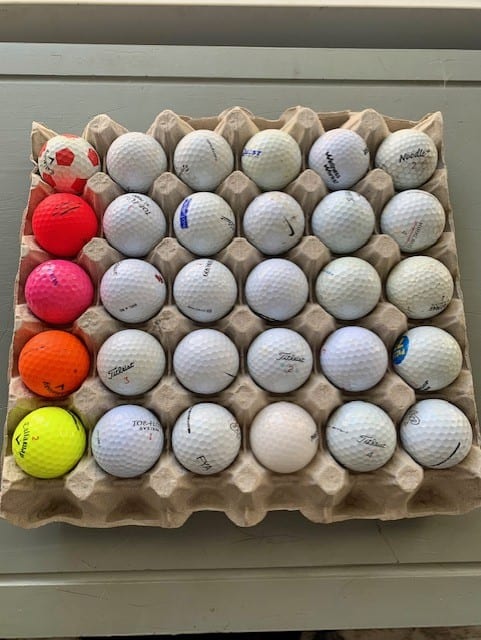 Egg cartons work well to hold used golf balls.