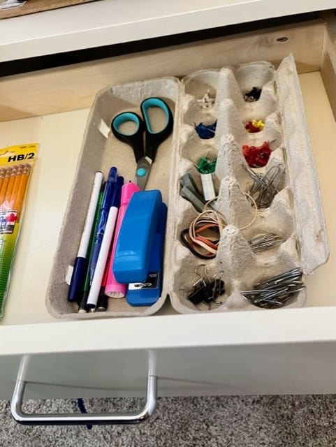 An egg carton works well to organize small office supplies like paper clips, thumb tacks and staples. And the top of the carton works to hold pens and pencils and other supplies.