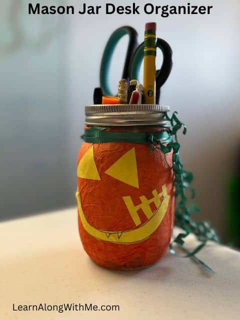 You can use mason jars to hold office stationary