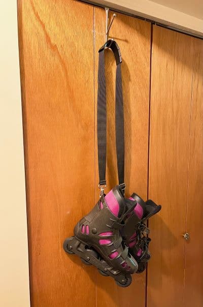 You can attach a shoulder strap - like from a duffel bag - to your inline skates then hang the skates from the strap