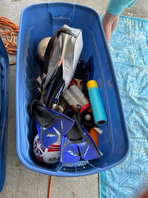 I used to use a large plastic tote to hold a variety of sports equipment